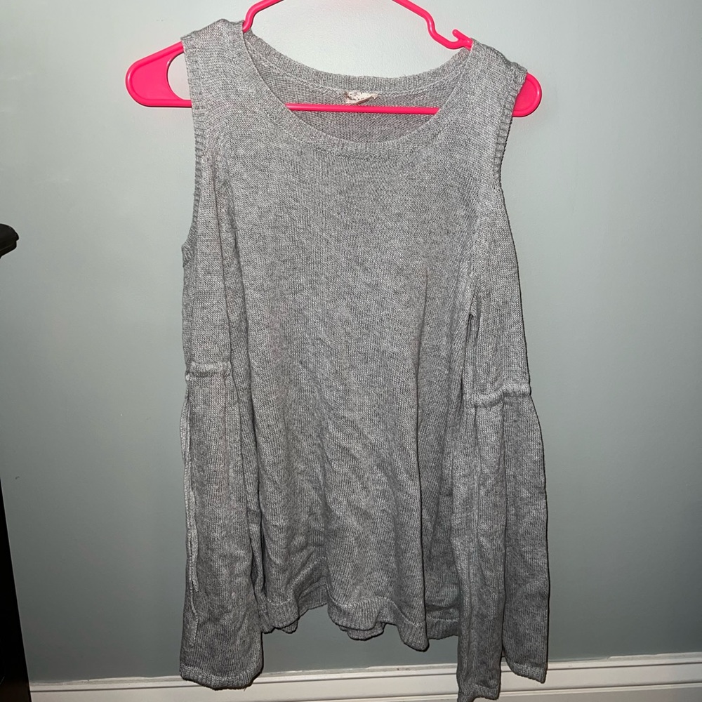 Women’s cold shoulder knit top.